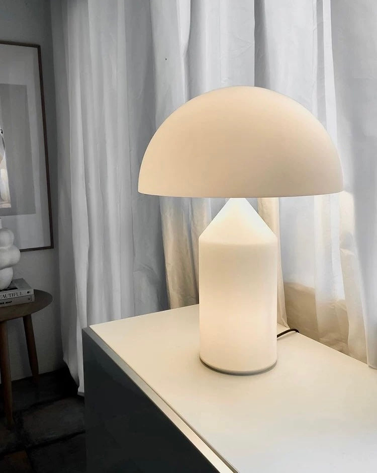 White dome table lamp with soft diffused warm light, perfect for bedroom nightstands, living rooms and minimalist interiors.