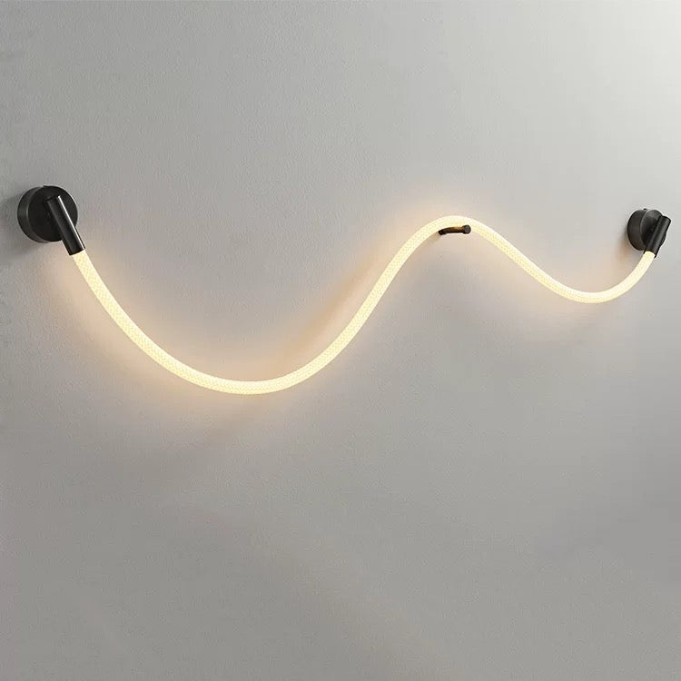 woven neon wall lamp b featuring a soft wave shaped led glow for modern ambient wall lighting