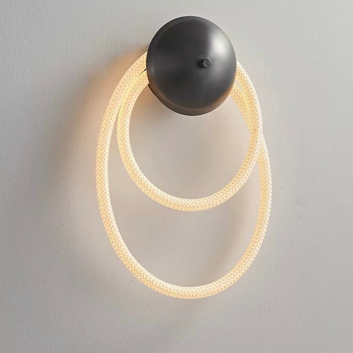 woven neon wall lamp d featuring flexible looped LED tubing providing warm ambient wall lighting on a modern interior wall