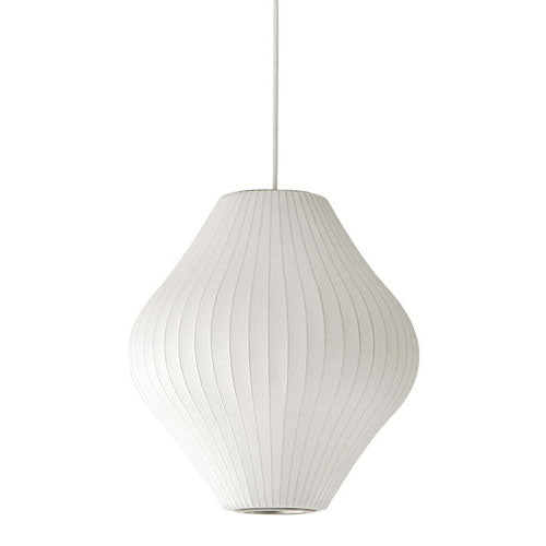 a single pendant light shown in isolation, creating soft ambient illumination with a calm and balanced vertical presence