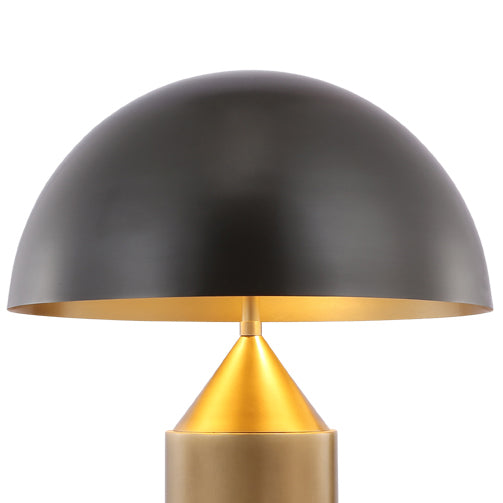 Black and brass table lamp featuring a sculptural dome shade and solid brass base, ideal for bedside lighting and contemporary interiors.
