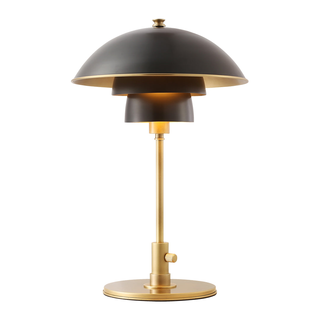 Modern table lamp with black dome shade and brass base, providing warm ambient lighting for contemporary Australian interiors.