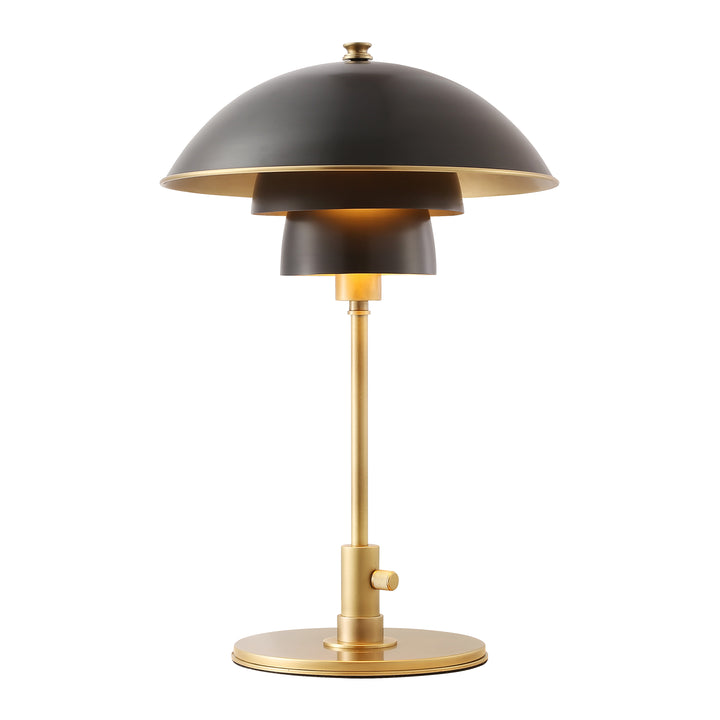 Modern table lamp with black dome shade and brass base, providing warm ambient lighting for contemporary Australian interiors.