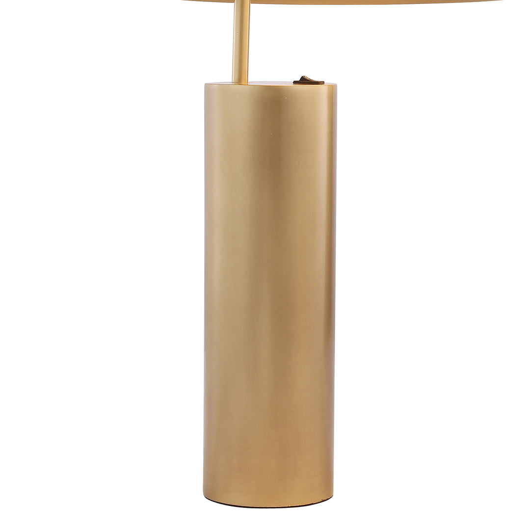 Detail view of brass cylindrical lamp base, showcasing refined craftsmanship and premium modern lighting design.
