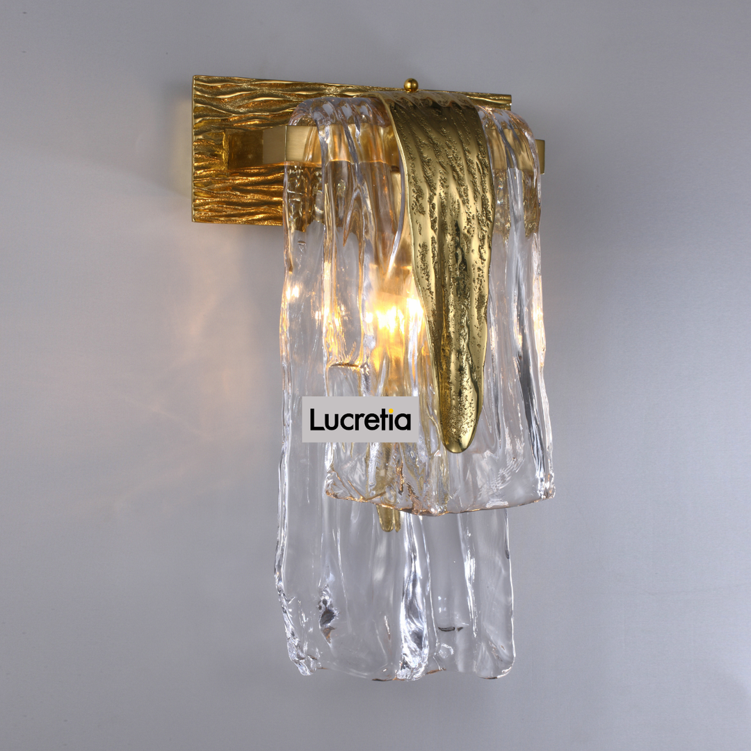 close-up front view of dali wall lamp showing cascading hand-blown glass and brass frame modern designer wall light