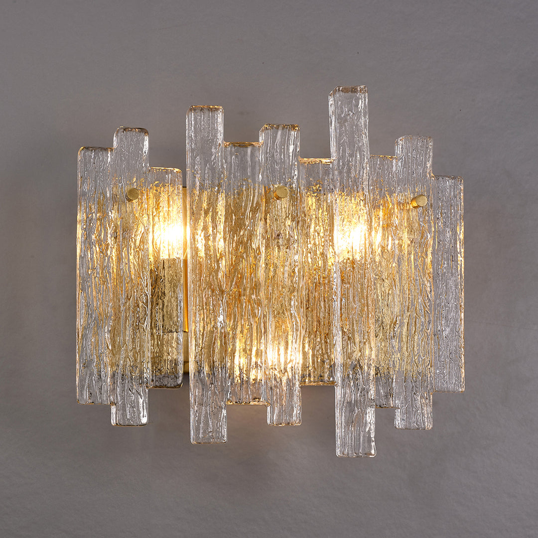 textured glass and brass eve wall lamp providing warm ambient lighting in a contemporary interior