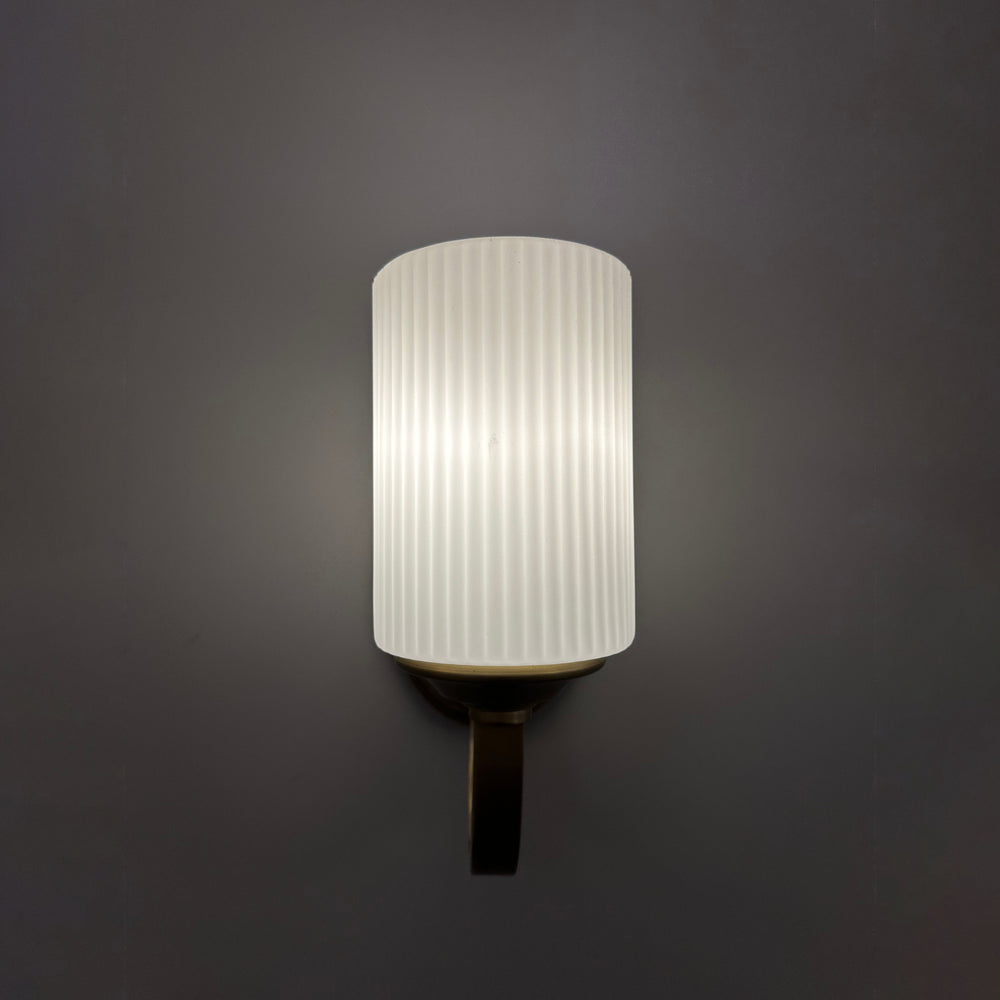 modern fluted glass wall light shown in front view suitable for bedside wall lighting hallway wall light and elegant ambient indoor illumination