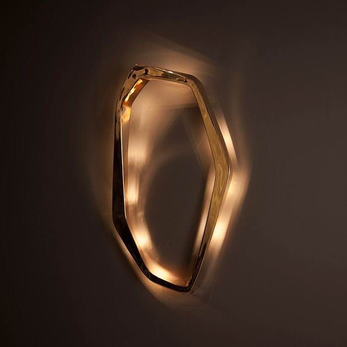 close-up view of i do wall lamp d sculptural organic metal ring led wall light creating warm ambient glow for modern interior walls