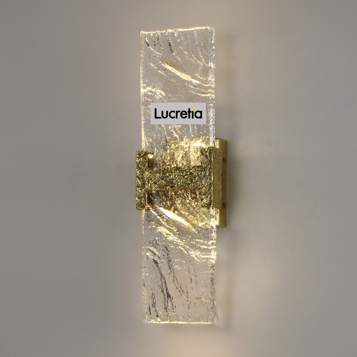 incu wall lamp with hand-carved brass detail and textured illuminated glass panel modern luxury led wall light for hallways bedrooms and boutique interiors