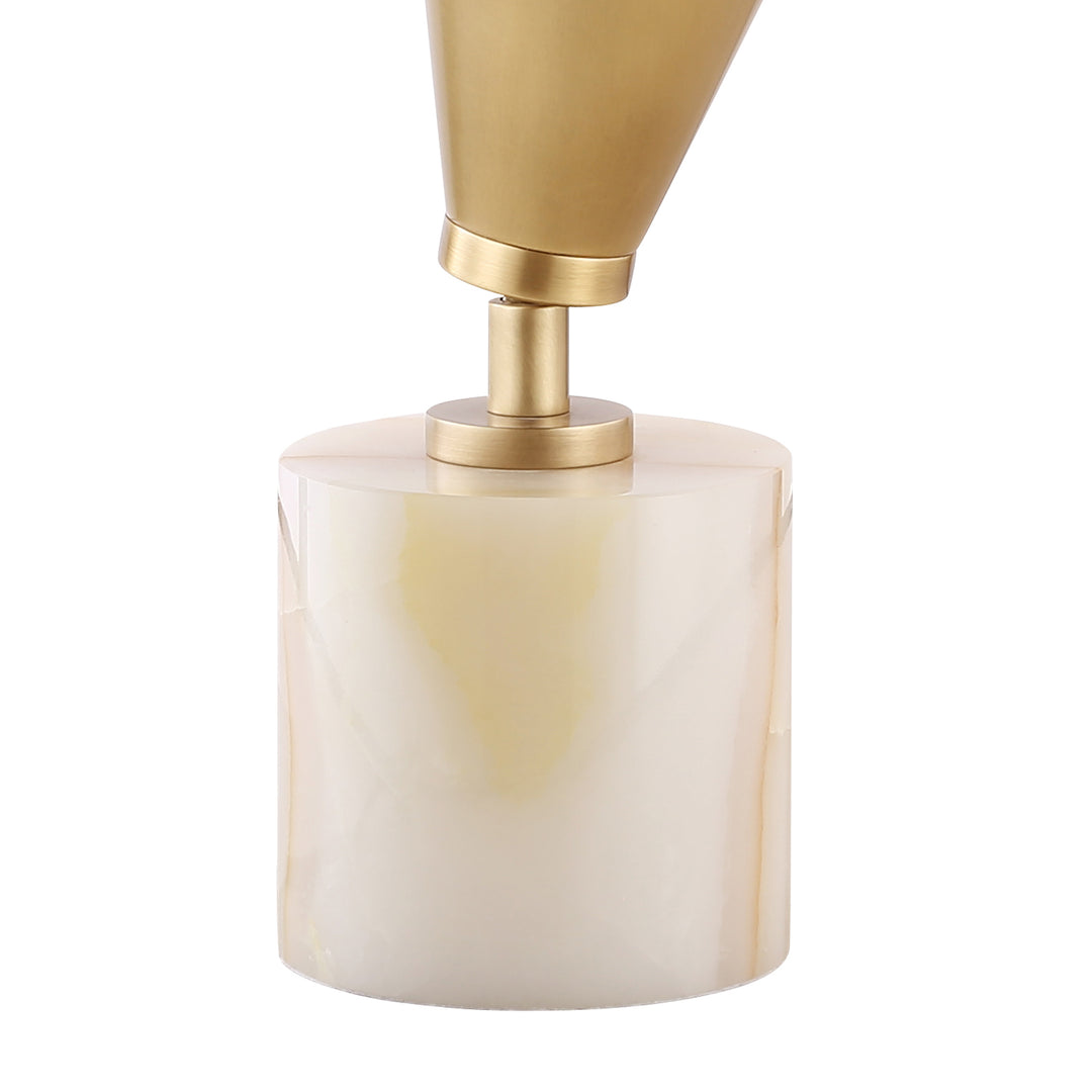 Close-up of jade base table lamp with modern brass shade, ideal for contemporary home décor and stylish console lighting.