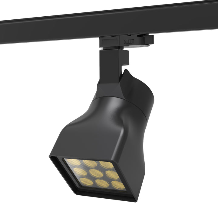 LED track-mounted wall washer fixture designed for even wall illumination in retail spaces, showrooms and architectural interiors