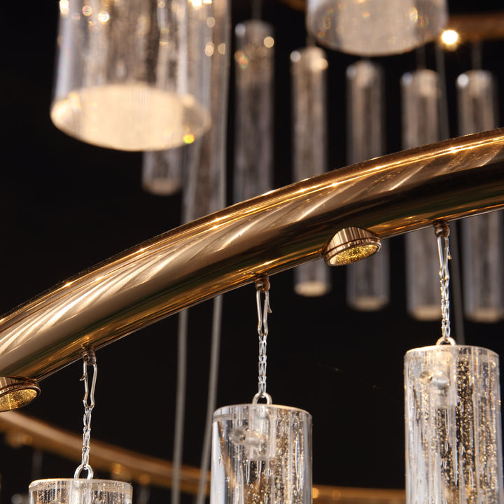 Close up of curved brass metal structure on Lucretia Eden custom pendant 16A with cascading crystal glass elements