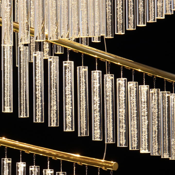 Side detail of Lucretia Eden custom pendant 16B showing layered hand blown crystal glass tubes and curved metal structure