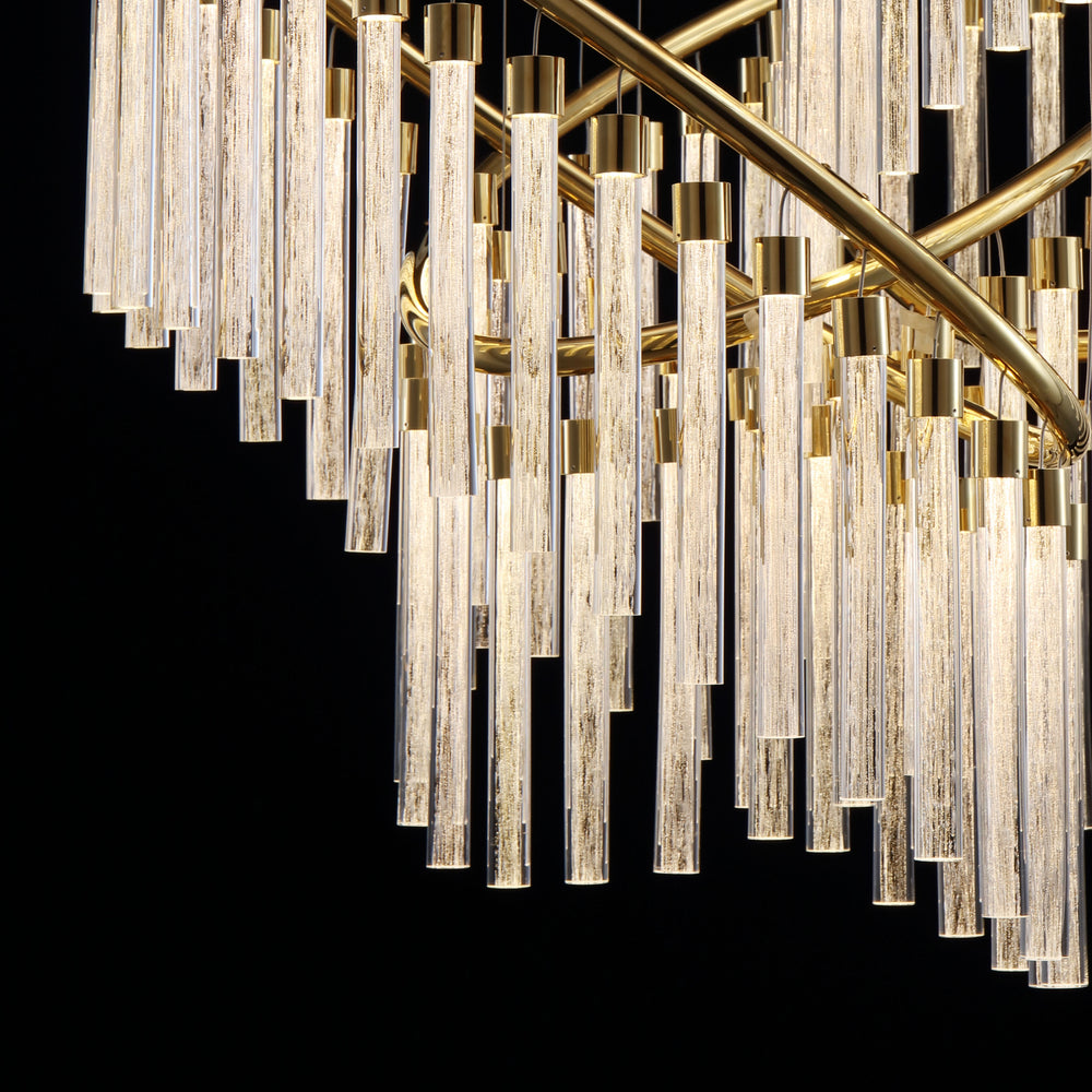 Close up of Lucretia Eden custom pendant showing layered hand blown glass tubes and precision metal framing