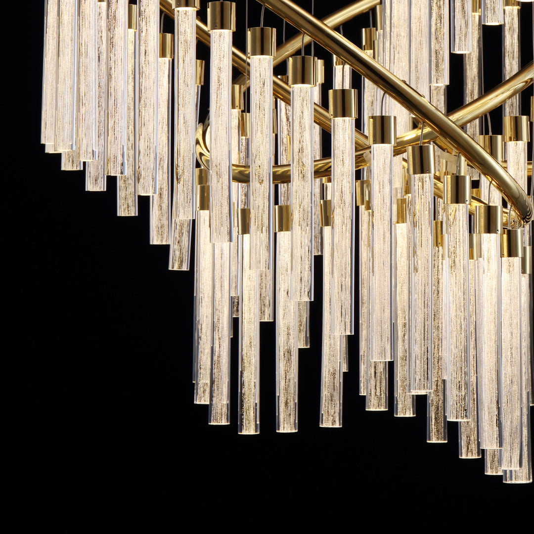 Close up of Lucretia Eden custom pendant showing layered hand blown glass tubes and precision metal framing