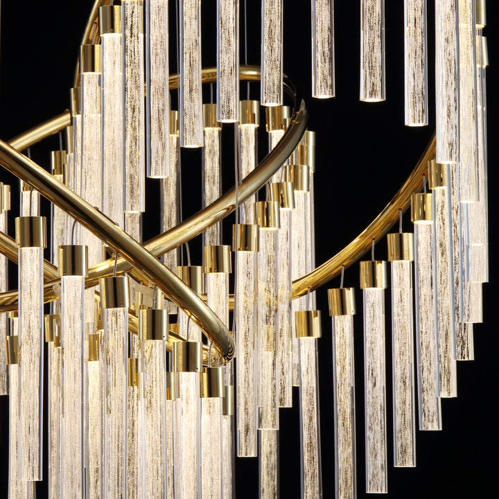 Curved brass frame and crystal tube detail of Lucretia Eden custom pendant for bespoke architectural lighting projects