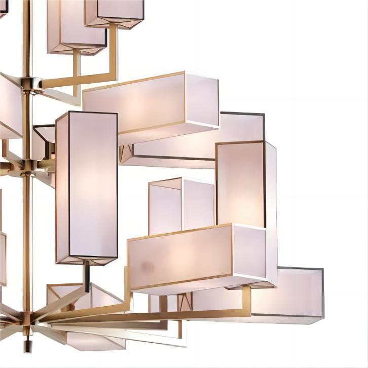 Close up detail of Lucretia Empire chandelier showing brass frame and fabric shade luxury lighting craftsmanship