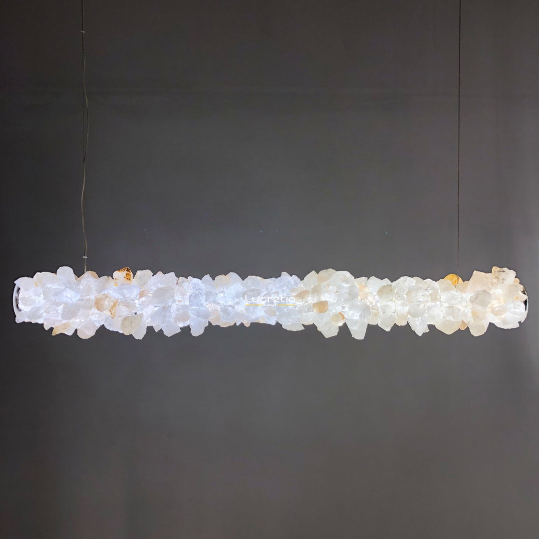 Belo Horizonte crystal linear pendant light crafted from Brazilian mineral crystal creating warm architectural lighting over long interior surfaces