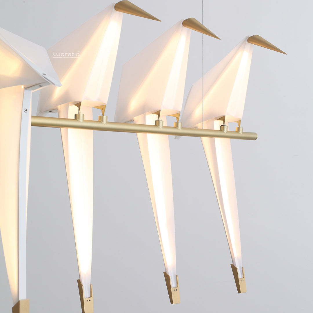 Birdcage Pendant Light 5 by Lucretia Lighting displayed in a modern interior with linear brass bird arrangement