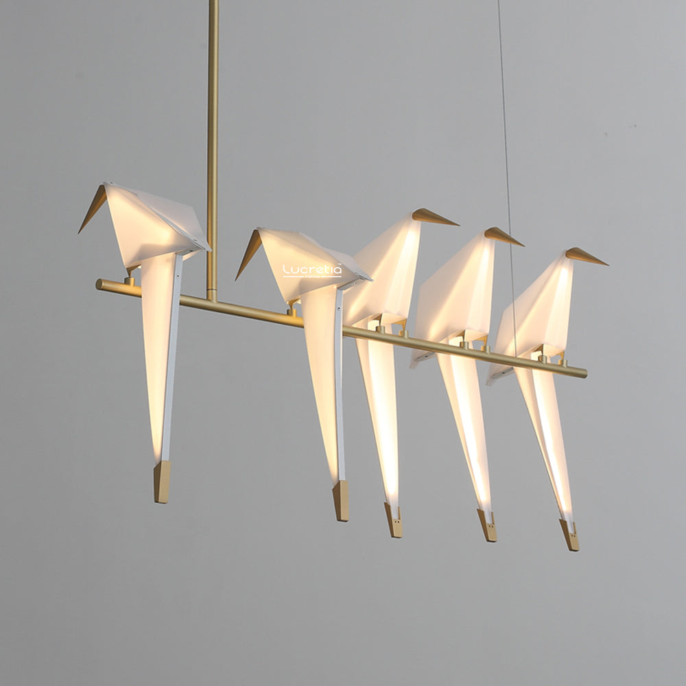 Birdcage Pendant Light 5 by Lucretia Lighting showing sculptural brass birds with soft LED illumination