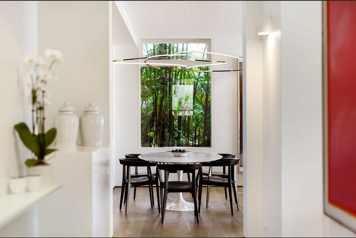 Lucretia Lighting Concordia designer linear pendant installed above dining table in modern residential interior