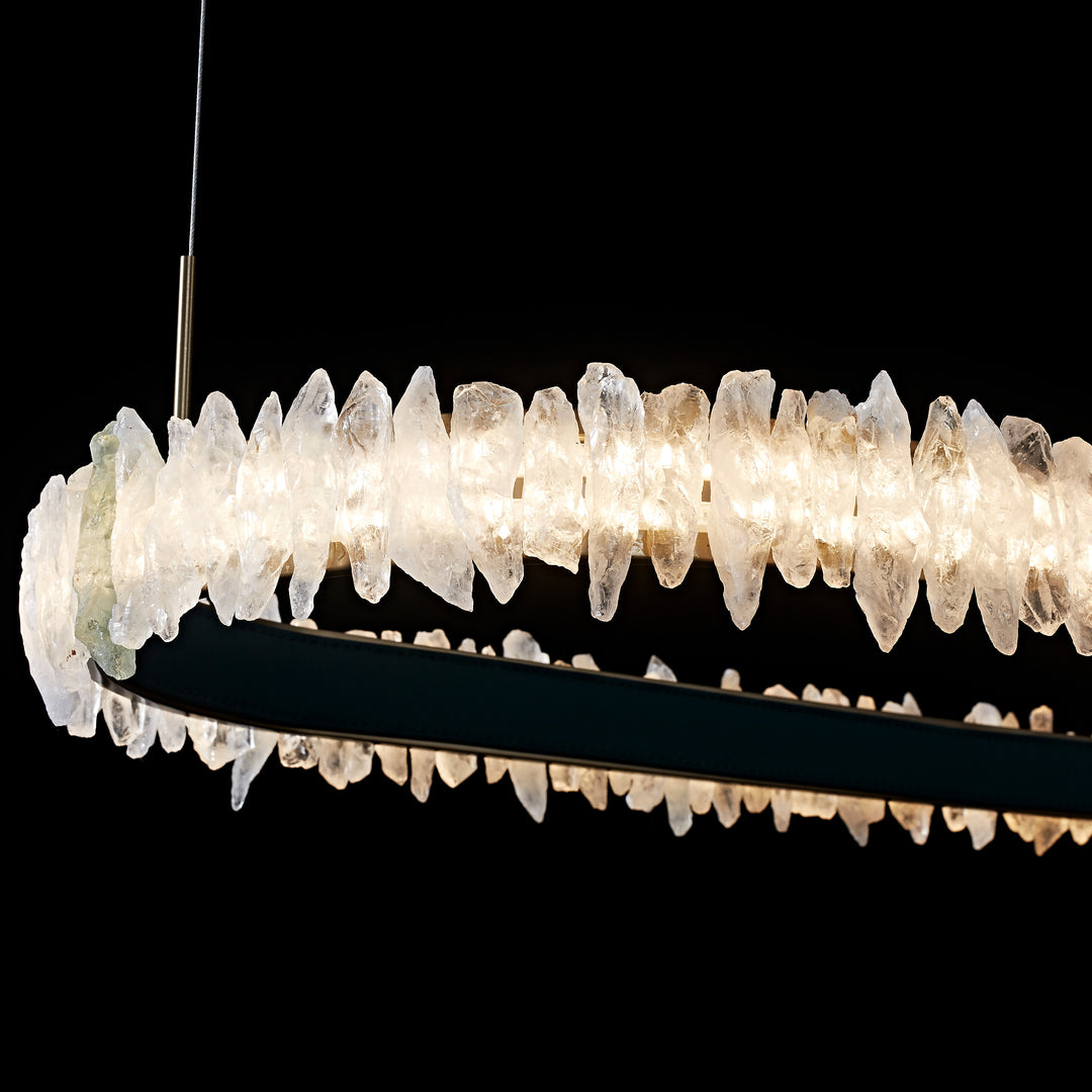Lucretia Lighting Couro e Cristal oval pendant close up showing hand selected crystal texture and luminous glow