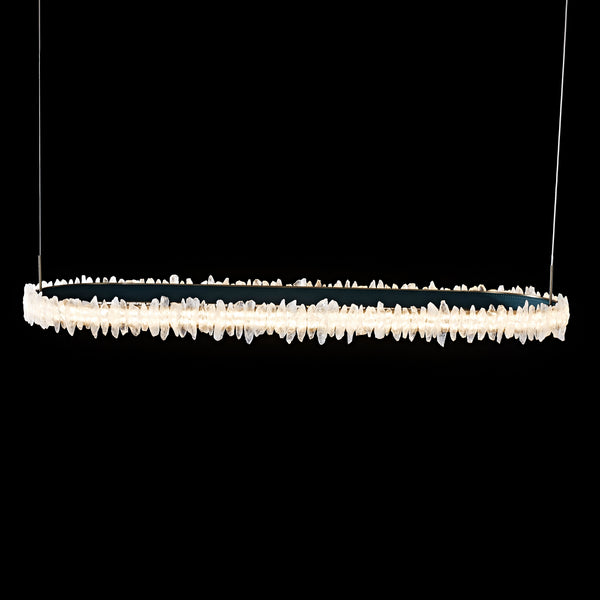 Lucretia Lighting Couro e Cristal oval pendant light with crystal and leather details suspended in dark studio setting