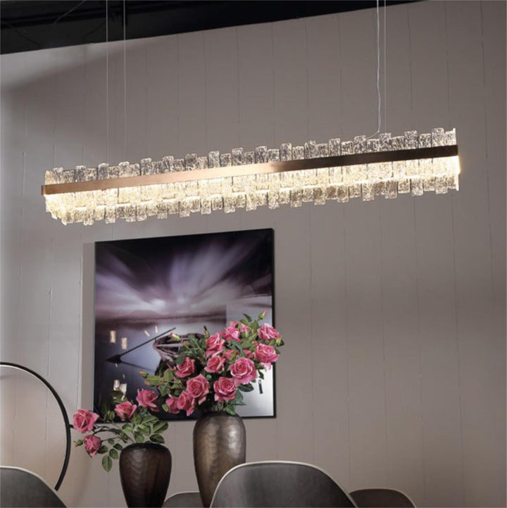 Crown Linear Pendant Light installed in a modern interior showing warm LED glow and crystal textured glass detail