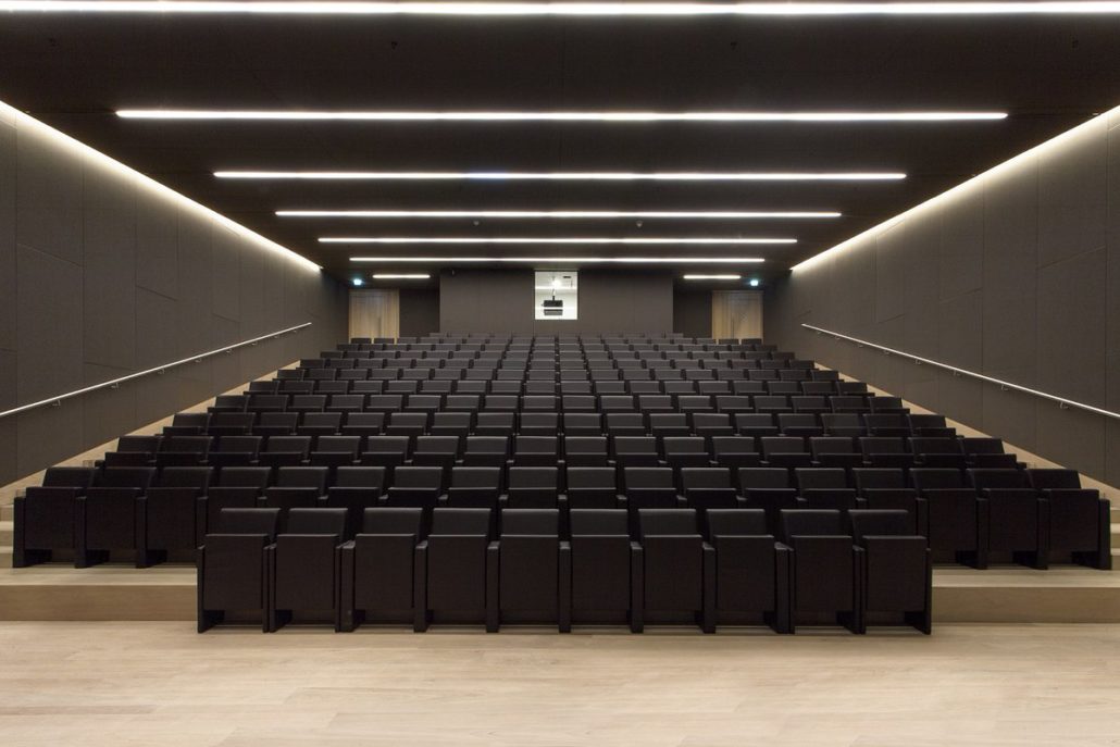 Endless 6588 linear lighting system illuminating auditorium space with uniform, large-scale commercial lighting performance