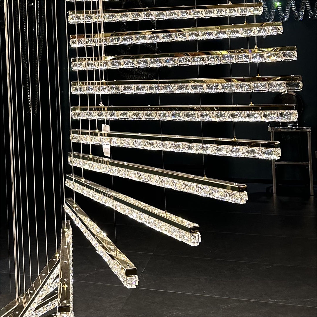 Lucretia Lighting Escalier crystal spiral pendant light displayed with tiered bespoke architectural crystal bar design