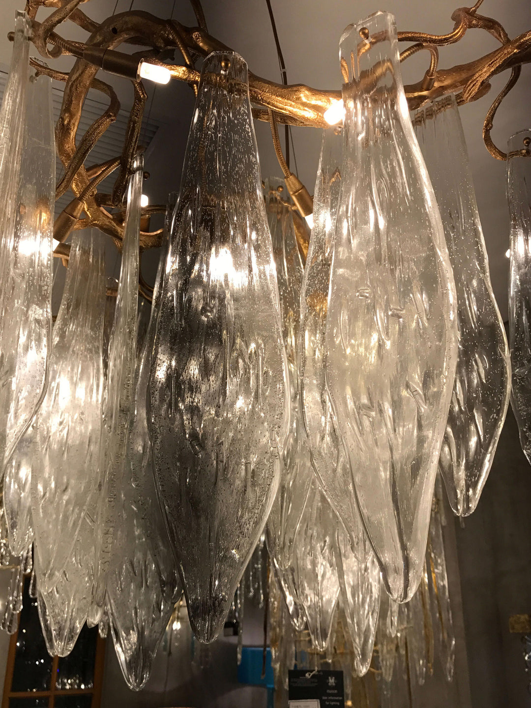 Glacier Brass Oval Chandelier by Lucretia Lighting shown with oval silhouette and radiant glass icicles