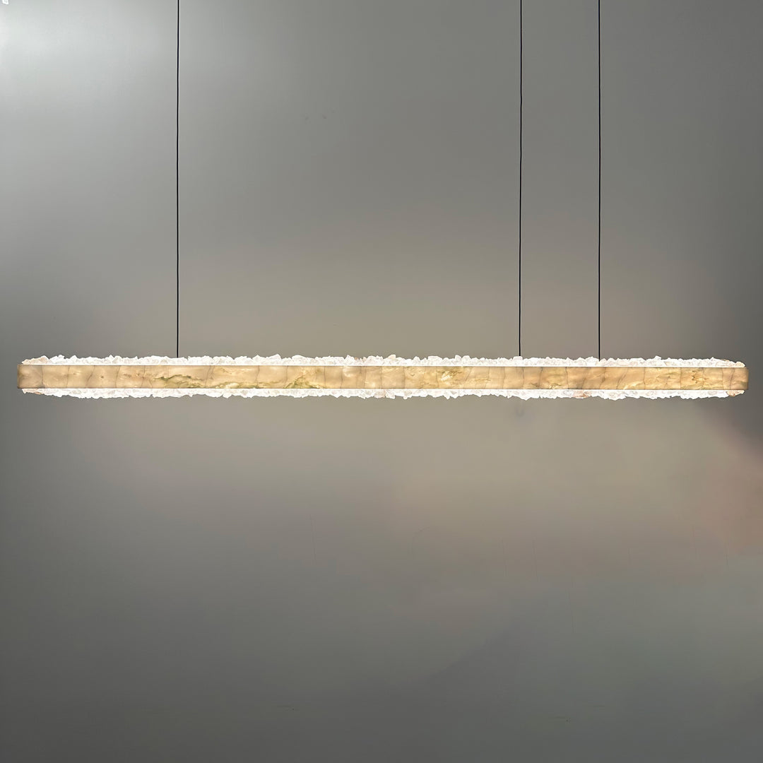 Marmore de Cristal LED linear pendant light combining marble and crystal above a modern kitchen island for refined architectural lighting