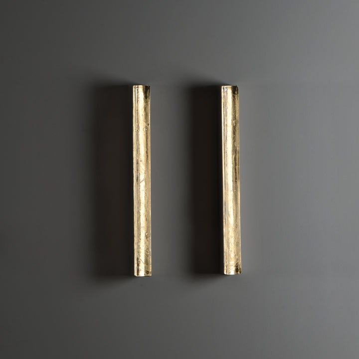 Running Water wall lamp crafted from textured glass with organic ripple pattern offering warm ambient lighting for modern interior wall light applications.