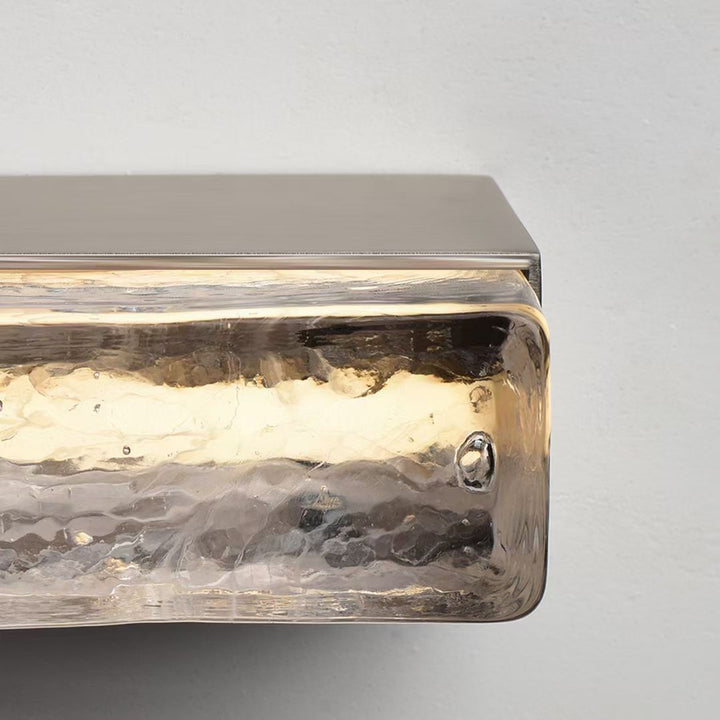 Running Water wall light textured glass detail displaying ripple and stone-like patterns suitable for designer wall lamp and interior lighting design.