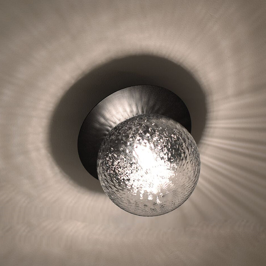 rippled glass sphere wall lamp close up showing soft ambient light reflections ideal for hallway wall lighting bathroom wall light and modern interior spaces