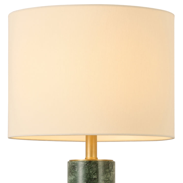 Table lamp with green marble base and refined fabric shade, ideal for modern bedrooms, consoles and luxury interior styling.
