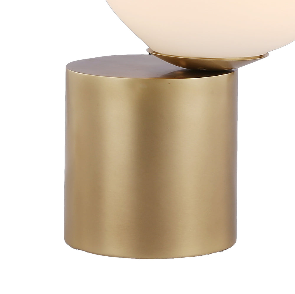 Modern balance lamp featuring brass base and opal glass sphere, ideal for contemporary consoles and bedside styling.