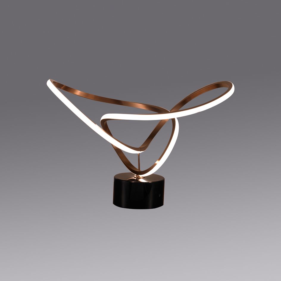 Modern LED table lamp featuring an artistic metal loop and warm integrated lighting, ideal for living rooms, bedrooms and contemporary decor.