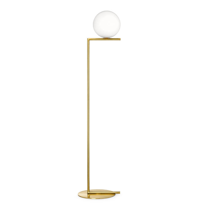 Designer opal globe floor lamp with slim gold frame in minimalist interior