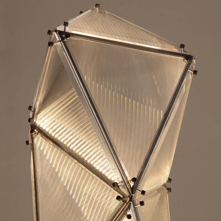 Close-up of the Proteus Floor Lamp showing geometric illuminated panel details.