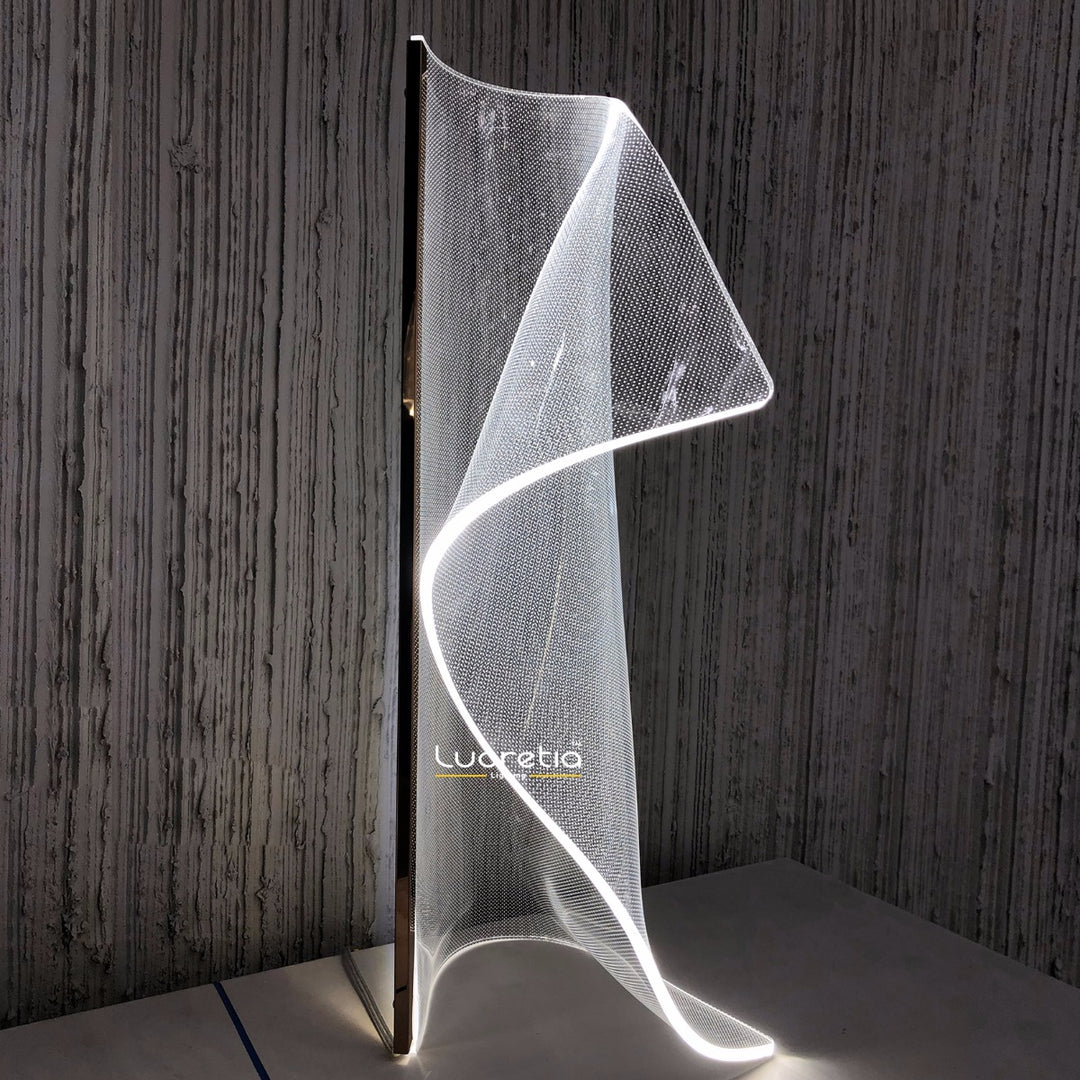 Silken A Table Lamp with sculptural light-guiding acrylic plate and flowing contours, ideal for modern living rooms, bedrooms and contemporary decor.