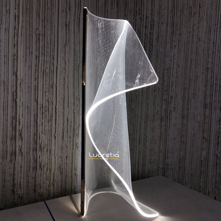 Silken A Table Lamp with sculptural light-guiding acrylic plate and flowing contours, ideal for modern living rooms, bedrooms and contemporary decor.