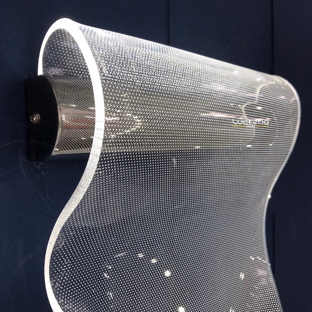 side view of sculptural acrylic wall lamp creating layered ambient lighting ideal for modern wall lamp applications in bedrooms living spaces and boutique interiors