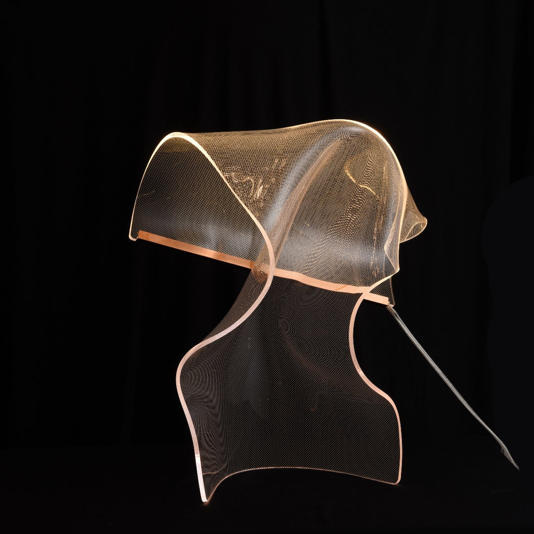 Silken C Table Lamp made from sculptural heated acrylic producing soft ambient glow for modern Australian interiors, living rooms and bedrooms.