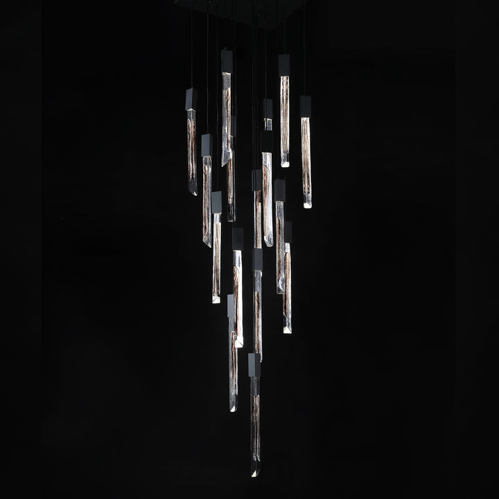Vertical stair void chandelier crafted from Swedish-imported glass suspended in double-height interior space