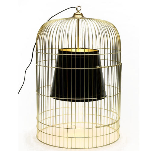 Sunset table lamp with a modern birdcage frame and black inner shade, creating warm ambient lighting for Australian living rooms and bedside spaces.