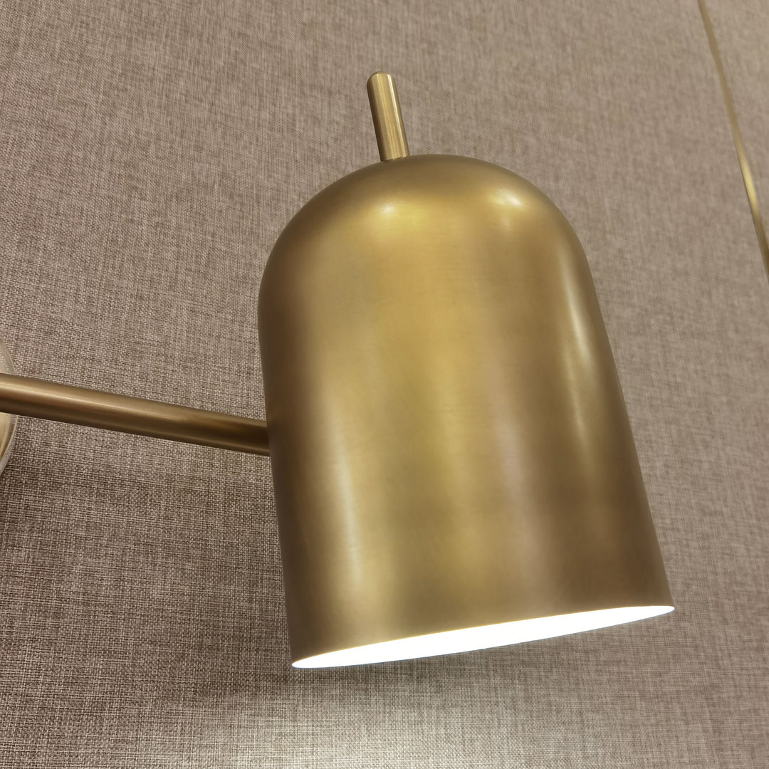 brass wall lamp installed on bedroom wall showing modern interior wall lighting perfect for bedside wall light and contemporary home décor