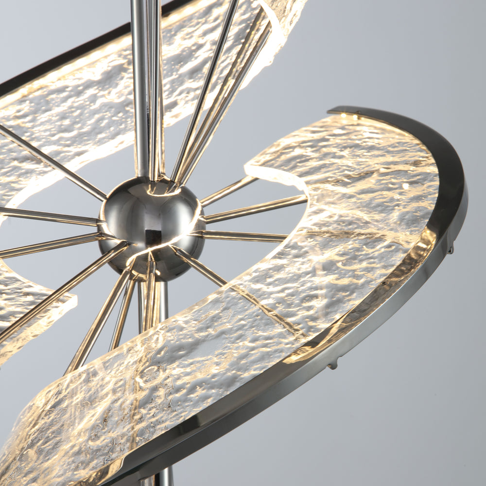 Close-up of twisted metal LED table lamp showing detailed stainless steel texture and modern craftsmanship.