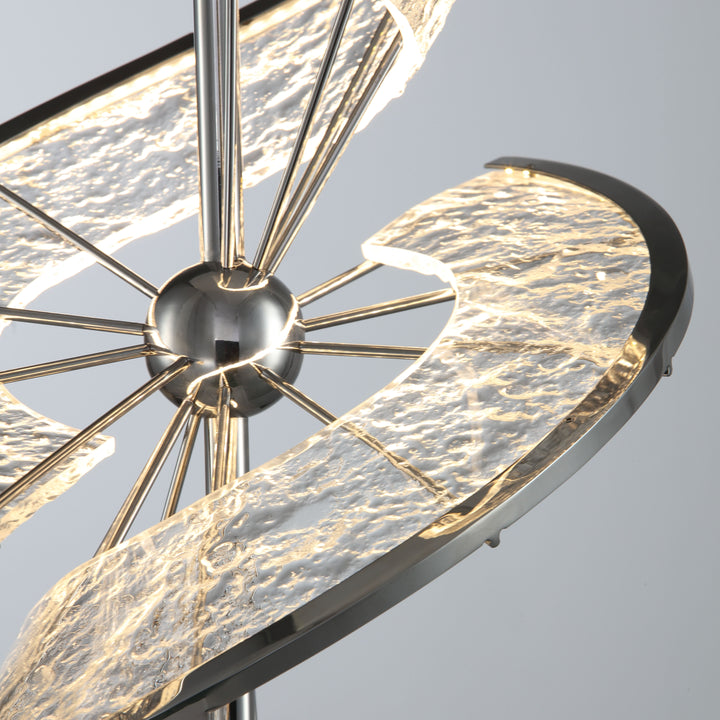 Close-up of twisted metal LED table lamp showing detailed stainless steel texture and modern craftsmanship.