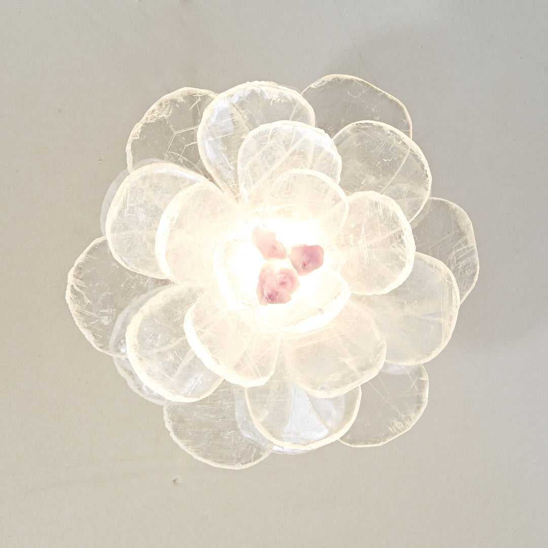vivi rock crystal flower wall lamp glowing softly as a designer decorative led wall light in a modern interior